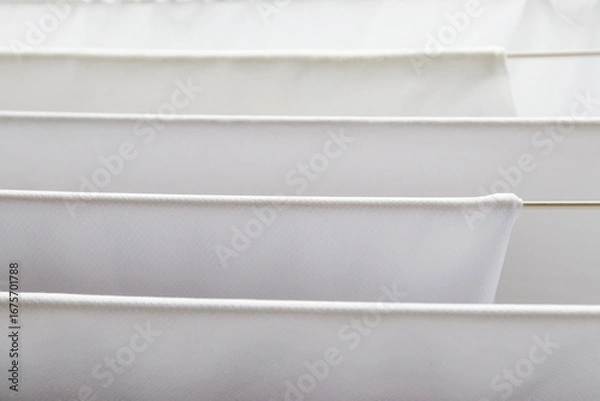 Obraz Washed white clothes on a hanger.