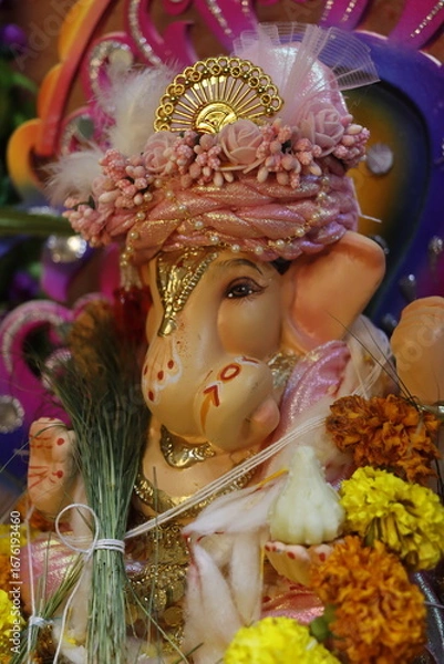 Fototapeta Ganapati festival celebration at home with a beautifully decorated Ganesh idol, flowers, lights, and traditional offerings, symbolizing devotion, prosperity, and cultural heritage in a festive atmosph