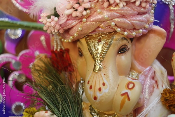 Fototapeta Ganapati festival celebration at home with a beautifully decorated Ganesh idol, flowers, lights, and traditional offerings, symbolizing devotion, prosperity, and cultural heritage in a festive atmosph