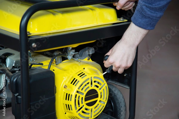 Fototapeta Portable gasoline generator.The use of an autonomous energy source. An additional source of energy