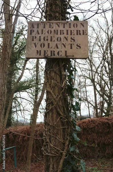 Fototapeta Panel of warning of a "palombière" in a zone of hunting.