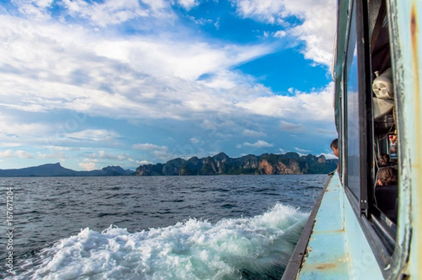 Obraz Side View of Public Ferry Sailing Against Coast and Sky