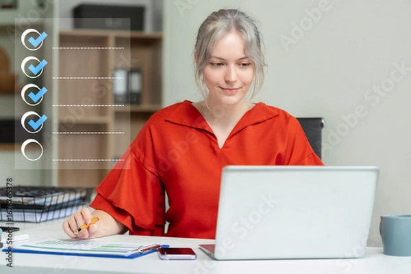 Fototapeta Business performance checklist concept, businesswoman using tablet and laptop doing online checklist survey, filling out digital form checklist.