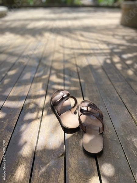 Obraz sandals on the wooden floor 
