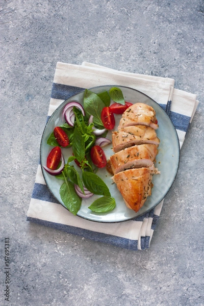 Obraz Baked chicken breast and fresh basil and tomatoes salad