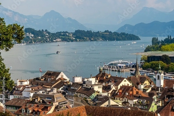Fototapeta Panoramic photo of red roofs of old town of Lucern with a view od the lake and mountains in the background