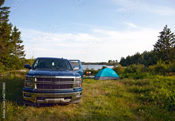 Fototapeta a pickup truck on a campsite