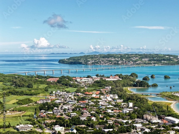 Fototapeta Aerial View of Kouri Island (古宇利島) and Kouri Bridge (古宇利大橋) with Village and Coastal Lagoon, Okinawa, Japan