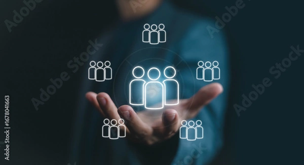 Fototapeta Hand holding digital people icons network, symbolizing human resources, teamwork, business management, leadership, collaboration, and modern organization in digital communication concept.