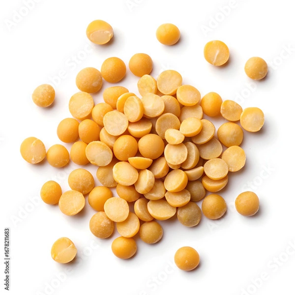 Fototapeta Close-up of split pigeon peas isolated on a white background, showing their flat, yellow halves