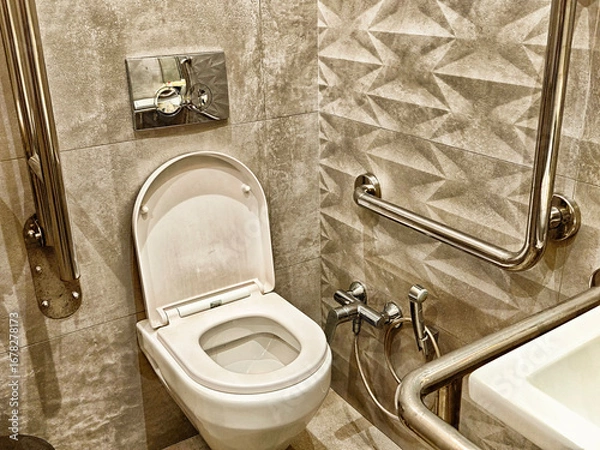 Fototapeta Accessible restroom with modern design and safety features in a public facility