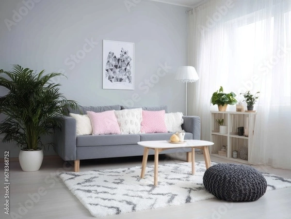 Fototapeta A stylish, modern living room with a gray sofa, delicate pink accents, and a soft, patterned rug.