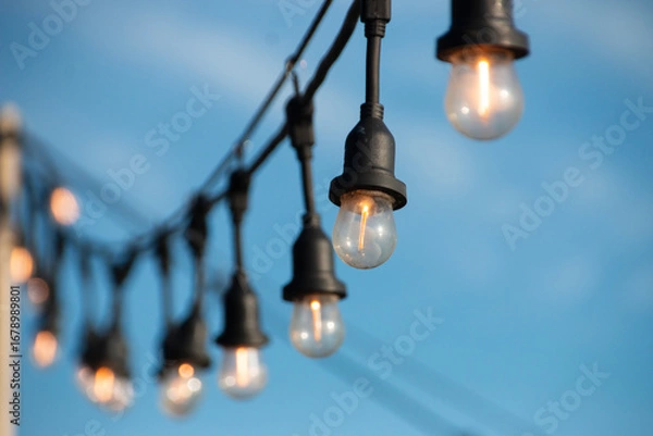 Fototapeta A close up. view of a hanging lights