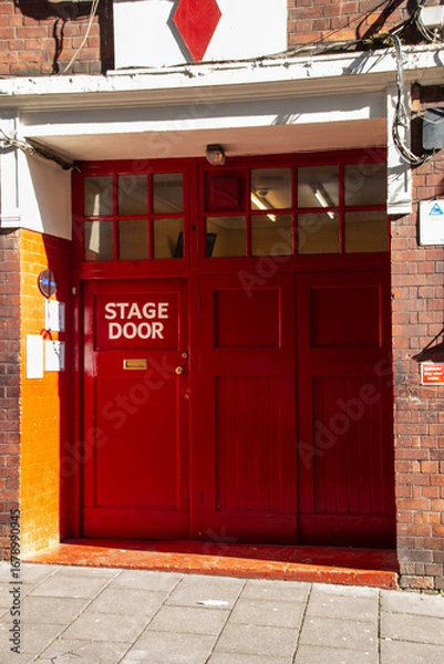 Fototapeta A close view of a red stage door back entrance