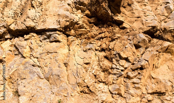 Fototapeta Stone cliffs in the mountains as a background