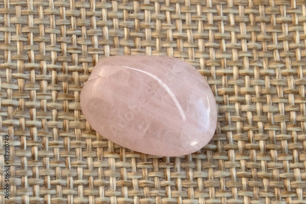 Obraz Several pieces of polished pink quartz on textured background. Minimal color still life photography