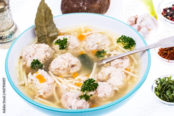 Fototapeta Broth with vermicelli and meatballs in a plate