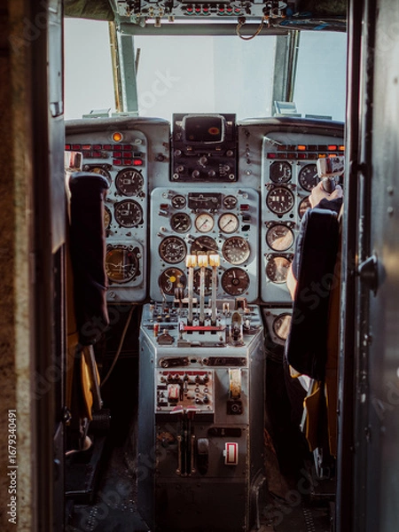 Fototapeta Cockpit with a control panel in an old aircraft