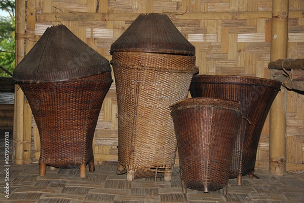 Fototapeta Traditional handwoven bamboo containers once used by ancient Mizos to store food and household property, showcasing their craftsmanship and practical ingenuity