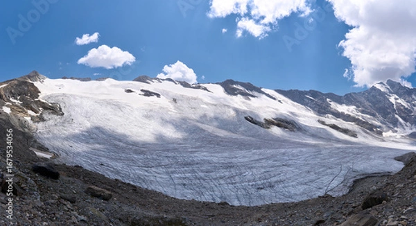 Fototapeta Mountain landscape with crevassed Glairetta glacier in the Graian Alps in Italy. Hiking trail from Benevolo refuge via the mountain pass Col Bassac Dere. Spectacular views along the glacier.