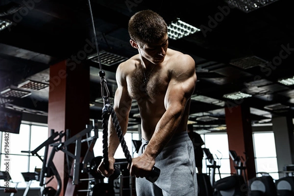 Obraz Strong man working in gym