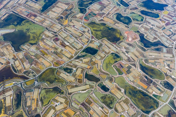 Fototapeta Aerial view of the dramatic landscape of the salt fields of Guerande in France