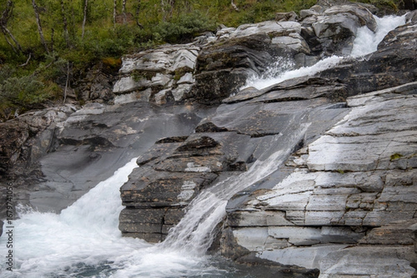 Obraz Silverfallet waterfall near the mountain village of Bjorkliden in Kiruna municipality, northern Sweden.