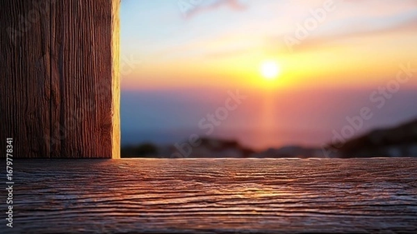 Fototapeta Stunning sunset view from a rustic wooden ledge overlooking a serene landscape with vibrant colors in the sky.