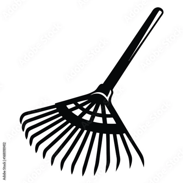 Obraz Silhouette of a rake used for gathering leaves and lawn maintenance