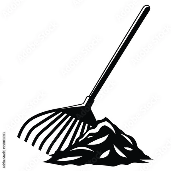 Obraz Black and white image of a rake and a pile of leaves