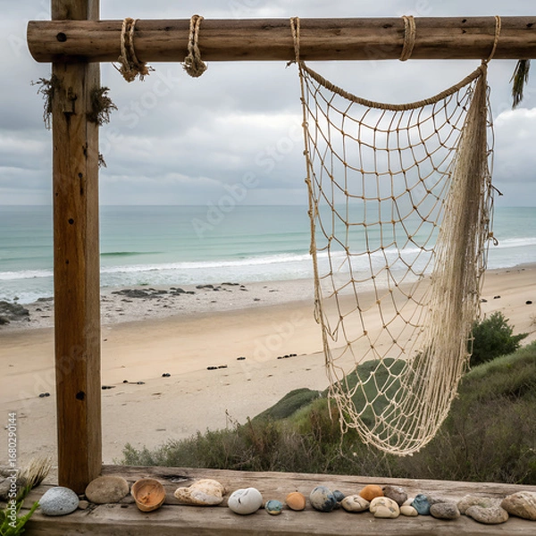 Fototapeta A fishing net hung on wood with a seaside background