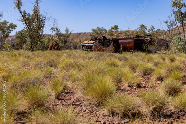 Fototapeta An old car in the Australian bush, rusty and abandoned.