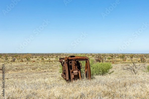Fototapeta An old car in the Australian bush, rusty and abandoned.