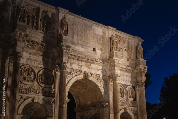 Obraz Night View of Illuminated Arch of Constantine in Rome with Historic Sculptures and Reliefs Under Deep Blue Sky