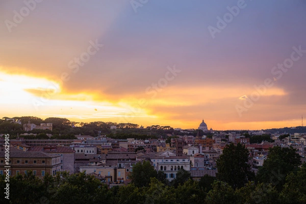 Obraz Sunset Skyline Over Rome with View of St. Peter’s Basilica Dome Illuminated Against Colorful Evening Sky