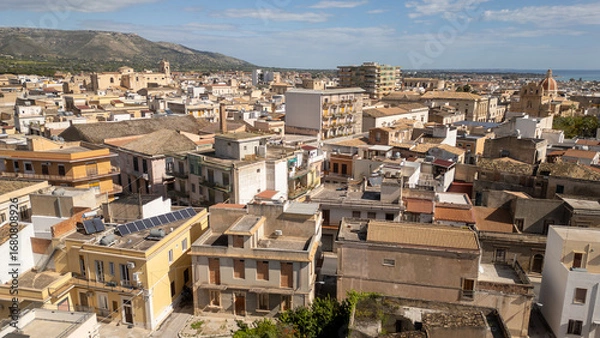 Obraz Evening lights over a Sicilian village – warm rooftops, winding streets, and the timeless charm of Italy from above.
