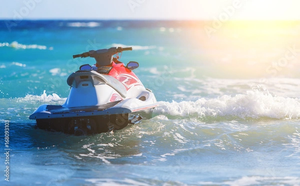 Fototapeta Jet Ski Moored inon on waves of sea