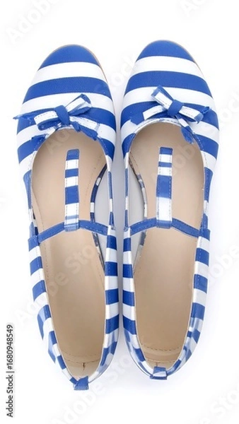 Fototapeta Stylish blue and white striped flats with decorative bows and ankle straps are presented against a plain white background.