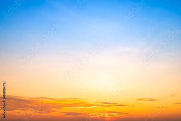 Fototapeta Beautiful , luxury soft gradient orange gold clouds and sunlight on the blue sky perfect for the background, take in evening,Twilight, Large size, high definition landscape photo