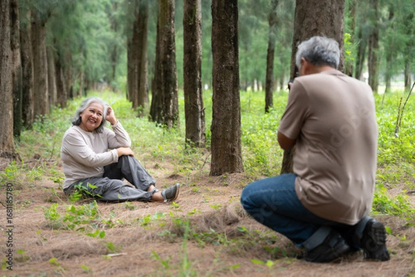Fototapeta A senior couple enjoys retirement together, exploring the outside world with a joyful spirit. Their romantic bond and caring relationship grow stronger with age, embracing travel and shared memories.