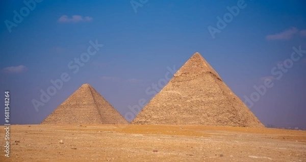 Fototapeta Ancient pyramids under a clear blue sky in Giza, Egypt