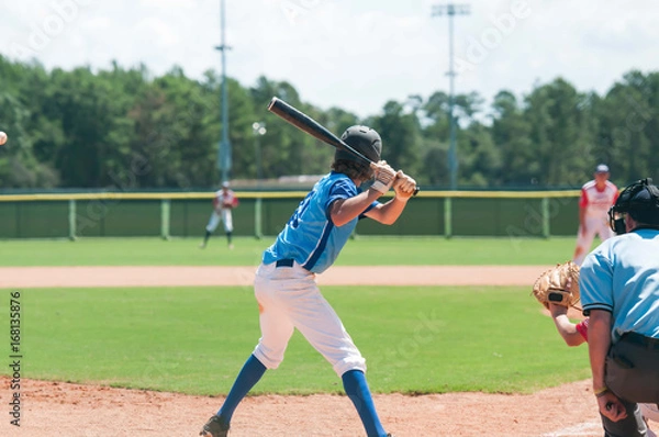 Fototapeta A batter about to hit a pitch during a baseball game