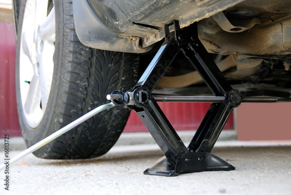 Fototapeta Changing a tire