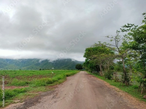 Fototapeta storm clouds over the mountain