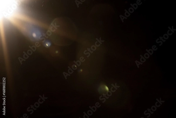 Fototapeta Flare light, effects sunlight, lens flare, light leaks, warm sun rays light effects, overlays or golden flare isolated on black background. effect, sunlight, ray beam, glow, bright, shine, sunrays.