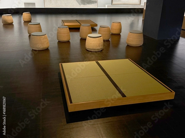 Fototapeta Woven reed seats in a public museum space. Traditional crafts in the modern world concept. Handheld mobile photo, selective focus, non AI