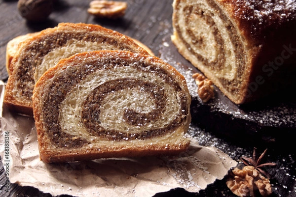 Obraz Walnut roll on a wooden background. Croatian orehnjaca