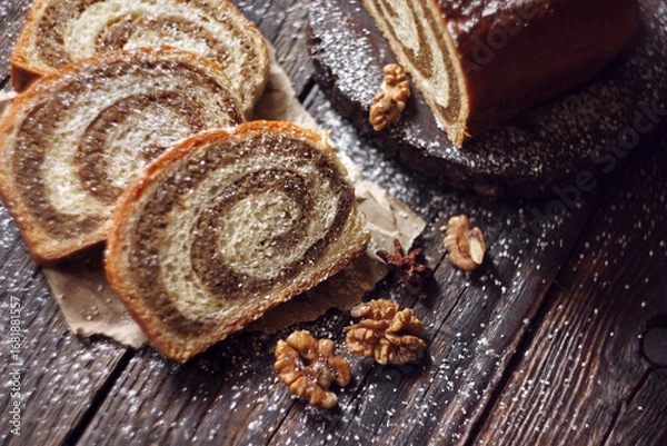 Obraz Walnut roll on a wooden background. Croatian orehnjaca