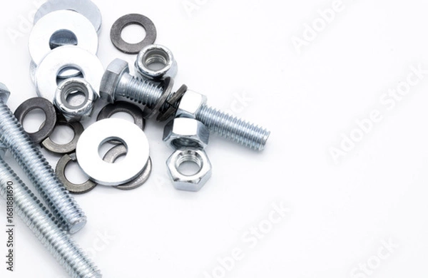 Fototapeta Set of screws of different types, allen, grade 5, hexagonal millimeter, eye bolts, washers, dowel, car screw, clamps on white background copy space	