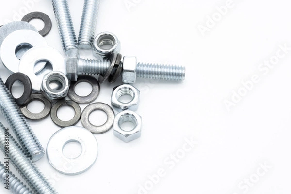 Fototapeta Set of screws of different types, allen, grade 5, hexagonal millimeter, eye bolts, washers, dowel, car screw, clamps on white background copy space